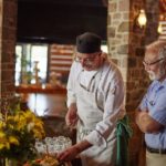 Arowhon Pines chef David Cooke samples a crudite from appetizer buffet