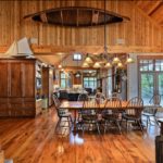 Dining room with vintage canoe mounted on wall