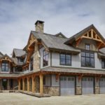 An exterior shot of a timberframe home with stone accents