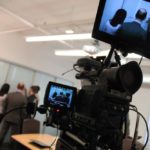 Clients discuss the project with FlashFrame staff