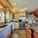 Open-concept kitchen with slate-topped island at Severn cottage