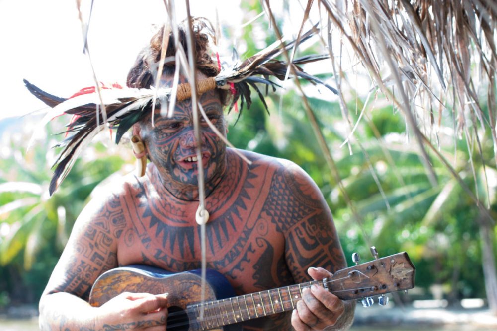 Tavita, musician, comedian, and one of Tahiti’s most tattooed people, welcomes guests to the Fare Pea Iti Romantic Lodge.